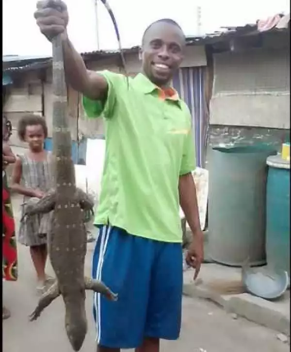 Man Rejoices After Killing This Massive Monitor Lizard With His "Bare Hands" (Photos)